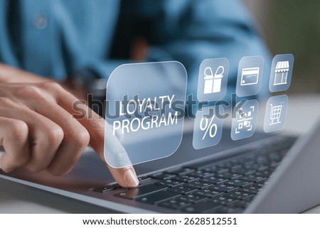 Loyalty program concept, Customer Engagement. Businessman using laptop computer with loyalty program icon on virtual screen.