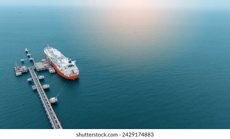 LPG ship, Oil tanker ship. Red Oil Tanker ranchored in Gas terminal gas tanks for storage. petroleum ship transportation import export fuel energy across red ocean sea. Vessel transport Gas  - Powered by Shutterstock