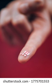 LSD Microdosing. Small or micro doses of LSD drug cut from a tab, presented on a finger. Microdosing practice is somewhat popular amongst students and creatives looking for improvement of focus   