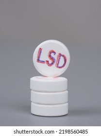 Lsd Pills Closeup On Gray Background, Lysergic Acid.

