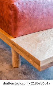 L-shaped armchair or sofa in solid oak or oak wood, with natural leather seat, polished concrete floor, big window