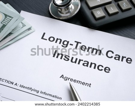 LTC Long-Term care insurance agreement and a pen.