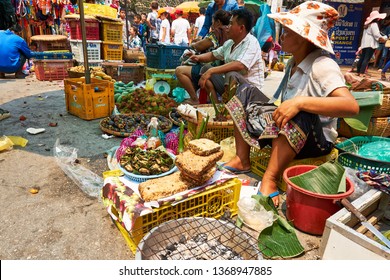 LUANG PRABANG, LAOS - APRIL 14, 2019. Local Lao people celebrating Pi Mai, at the market. Lao New Year, big water festival