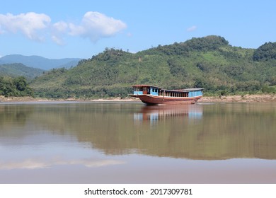 Luang Prabang, Laos - Nov 28, 2018: Slow Boat Crossing The Mekong River.