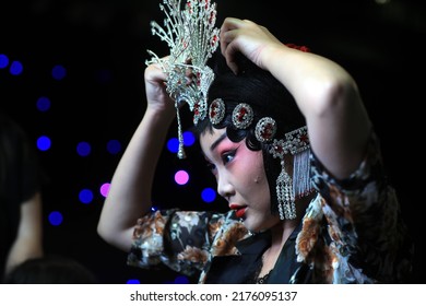 LUANNAN COUNTY, China - August 11, 2021: A Beijing Opera Actress Is Making Up Backstage, North China