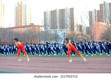 LUANNAN COUNTY, China - December 6, 2021: Middle School Students' Ice And Snow Aerobics Performance Is On The Playground, North China