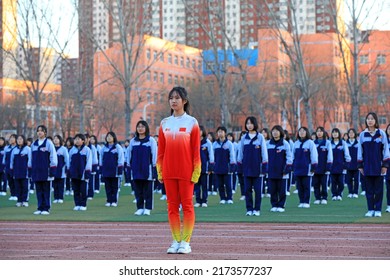 LUANNAN COUNTY, China - December 6, 2021: Middle School Students' Ice And Snow Aerobics Performance Is On The Playground, North China