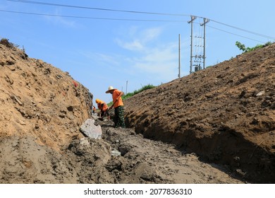 LUANNAN COUNTY, China - July 26, 2021: Workers Are Building Slope Protection Foundation At A Construction Site.