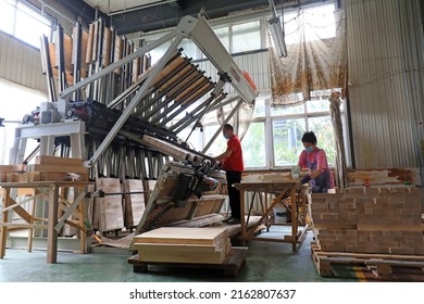 LUANNAN COUNTY, China - July 6, 2021: Workers Work Hard On The Furniture Production Line, China