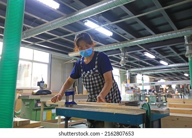 LUANNAN COUNTY, China - July 6, 2021: Workers Work Hard On The Furniture Production Line, China