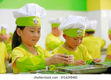 LUANNAN COUNTY, China - June 14, 2018: Children In Kindergarten Are Learning To Make Zongzi, LUANNAN COUNTY, Hebei Province, China