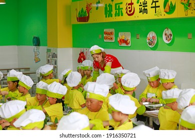 LUANNAN COUNTY, China - June 14, 2018: Children In Kindergarten Are Learning To Make Zongzi, LUANNAN COUNTY, Hebei Province, China