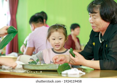 LUANNAN COUNTY, China - June 14, 2018: Children In Kindergarten Make Zongzi With Their Parents, LUANNAN COUNTY, Hebei Province, China