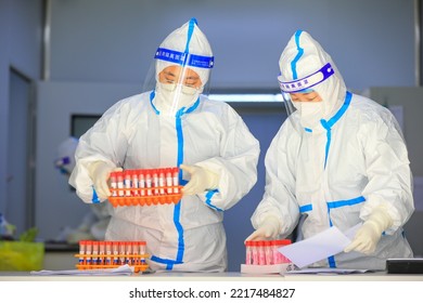 LUANNAN COUNTY, China - March 22, 2022: Medical Staff Are Counting Nucleic Acid Test Samples In A Test Center, North China