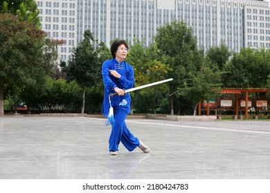 LUANNAN COUNTY, China - September 12, 2021: People Practice Tai Chi Sword In The Park, North China