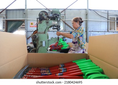 LUANNAN COUNTY, China - September 14, 2021: Workers Work Hard On The Sickle Processing Production Line, North China

