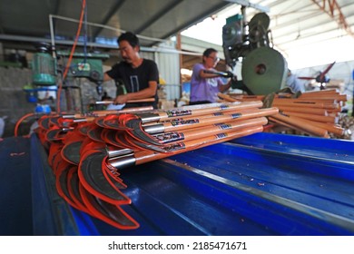 LUANNAN COUNTY, China - September 14, 2021: Workers Work Hard On The Sickle Processing Production Line, North China

