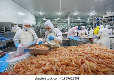 LUANNAN COUNTY, Hebei Province, China - March 17, 2020: The Workers Are Busy In A Modern Broiler Processing Factory On The Production Line Of Broiler Segmentation.