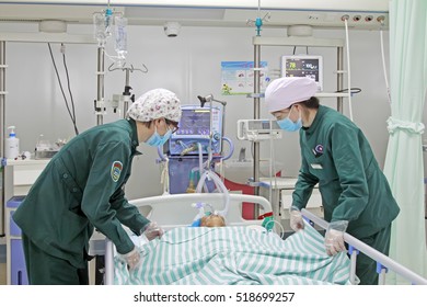 Luannan County - June 18th: Nurses In Intensive Care Unit Busy, June 18th, 2015, Luannan County, Hebei Province, China
