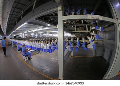 Luannan County - May 10, 2019: Workers Are Busy On The Nitrile-butadiene Glove Production Line In The Factory, Luannan County, Hebei Province, China.