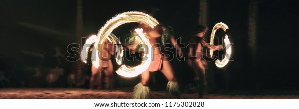 Luau party polynesian fire dancers throwing fire\
torches at night on beach resort. Hawaiian cultural activity,\
polynesia culture banner.