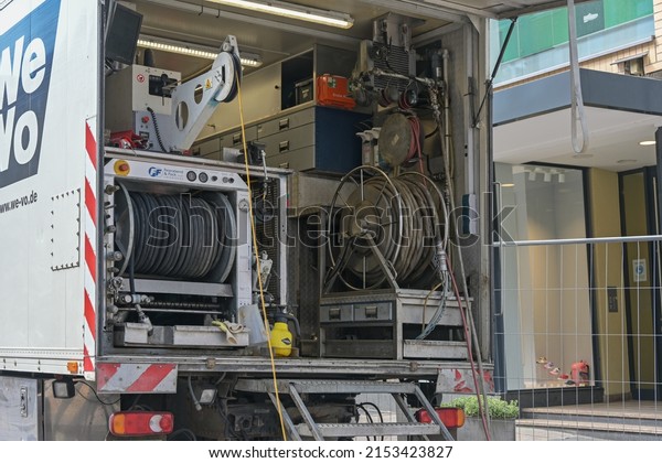 Lubeck,\
Germany, May 4, 2022: Truck with equipment for sewer works such as\
hoses, pneumatic pumping unit, cables and machines, professional\
technology on a construction site, selected\
focus