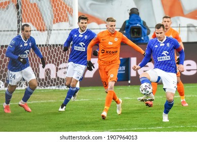 LUBIN, POLAND - JANUARY 29, 2021: Match PKO Ekstraklasa KGHM Zaglebie Lubin Vs Wisla Plock 0:2. In Action Angel Garcia Cabezali (24) Jakub Wojcicki (23) Alan Uryga (R)