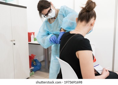 LUBIN, POLAND - MAY 11, 2021. Common Vaccination Point Against Covid-19. The Doctor Vaccinates The Woman In The Arm.