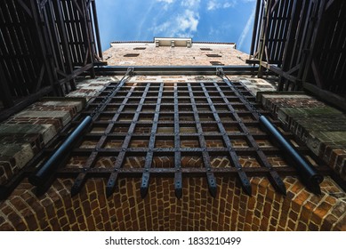 Lublin, Poland - September 6, 2019: Portcullis at Cracow Gate (Brama Krakowska) seen upwards and leading to Old Town