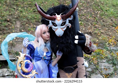 Lucca, Tuscany, Italy - November 1, 2022: Cosplayers Dressed As Characters From The Video Game Genshin Impact At The Lucca Comics And Games 2022 Cosplay Event.