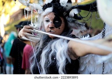 Lucca, Tuscany, Italy - October 29, 2022: Close Up Of Cosplayer Girl Dressed As Fantasy Angel With Bow And Arrow At The Lucca Comics And Games 2022 Cosplay Event.