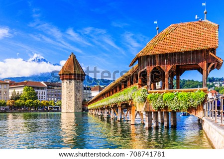 Lucerne, Switzerland. Historic city center with its famous Chapel Bridge and Mt. Pilatus on the background. (Vierwaldstattersee),