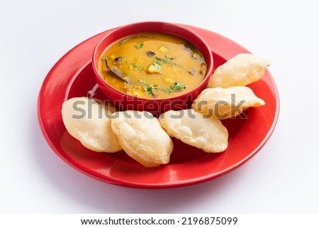 Luchi Cholar Dal or Fried bread made of flour served along with curried Chana or Bengal gram