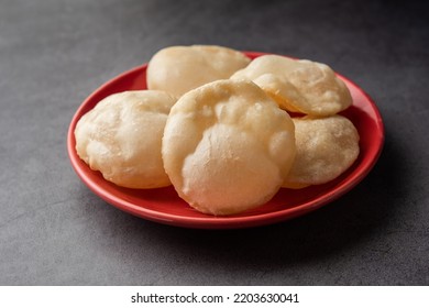 Luchi or Lusi is a deep-fried poori or flatbread, made of Maida flour, originating from Bengal