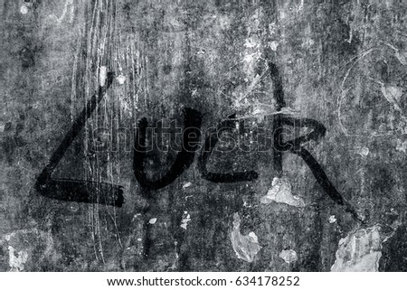 Yearning is worse than longing. This is written on a brown wall in white writing.
