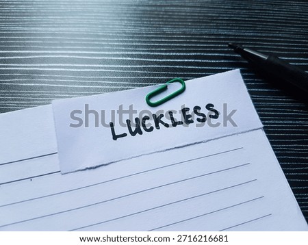 Luckless writting on table background. 