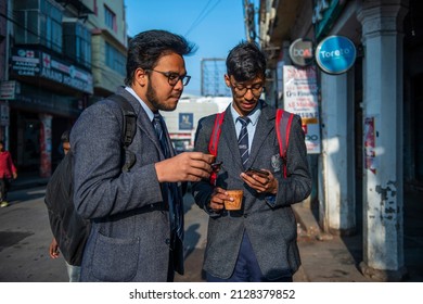 Lucknow, Uttar Pradesh, India, Feb 18 2022: School going student sipping kulhad tea at sharma tea stall in hazratganj old Lucknow.
