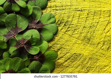 Lucky Clover Border On Black Yellow Wooden Background