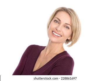 Lucky isolated blond mature woman with white teeth and pullover in bordeaux color.