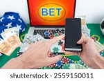 Lucky man celebrating money win. Male fan watching football play online broadcast on his laptop, cheering for his favorite team and making bets at bookmaker