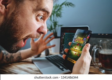 Lucky Man Celebrating Victory After Winning Jackpot In Online Casino.