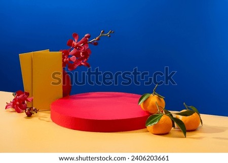 Lucky money envelopes, orchids and tangerines are decorated next to a red podium. Two-color background beige and blue. Ideal space to display seasonal products.
