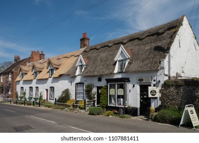 Ludham, Norfolk, England - May 07 2016: Thatched cottages and village tea room