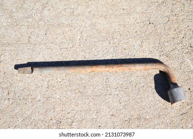 Lug Wrench On A Patch Of Concrete