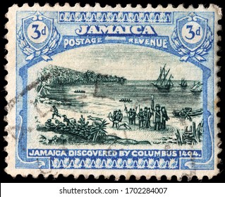 LUGA, RUSSIA - APRIL 10, 2020: A Stamp Printed By JAMAICA Shows Christopher Columbus Landing In Jamaica In 1494, Circa 1921.