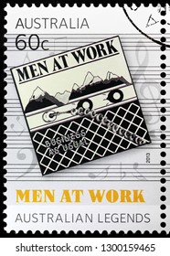 LUGA, RUSSIA - JANUARY 22, 2019:  A stamp printed by AUSTRALIA shows cover of  the debut studio album by Australian new wave band Men at Work - Business as Usual, circa 2013.