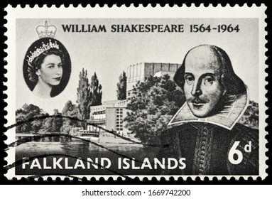 LUGA, RUSSIA - OCTOBER 20, 2019: A stamp printed by FALKLAND ISLANDS shows William Shakespeare and The Royal Shakespeare Theatre in the town of Stratford-upon-Avon, circa 1964