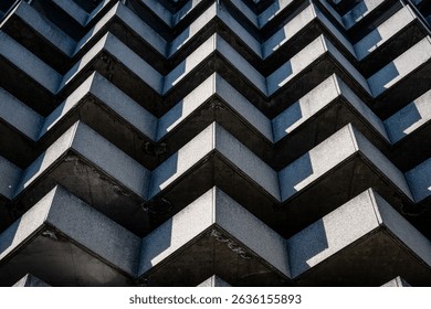 Lugano, Building facade pattern: Close up view of a modern building facade in Lugano featuring a repetitive staggered pattern of balconies