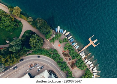 Lugano City Park Entrance With Boats And The Lake Of Ticino And Trees And Flowers Taken With A Drone