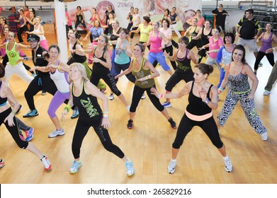 Lugano, Switzerland - 10 november 2013: People dancing during Zumba training fitness at a gym of Lugano on Switzerland